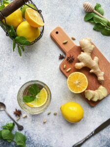 sliced lemon beside sliced lemon on chopping board